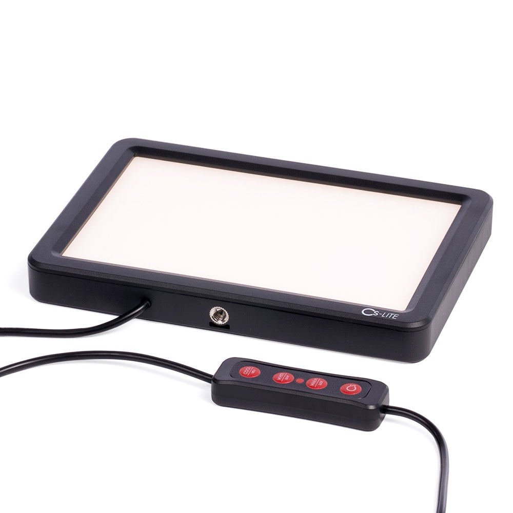 CS-LITE Light Source and a remote control on a white background.