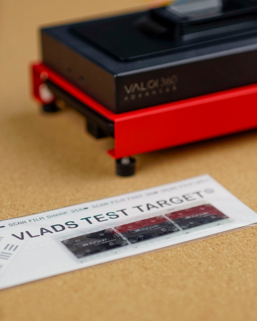 Vlad's Test Targets close-up with VALOI product on a brown background.