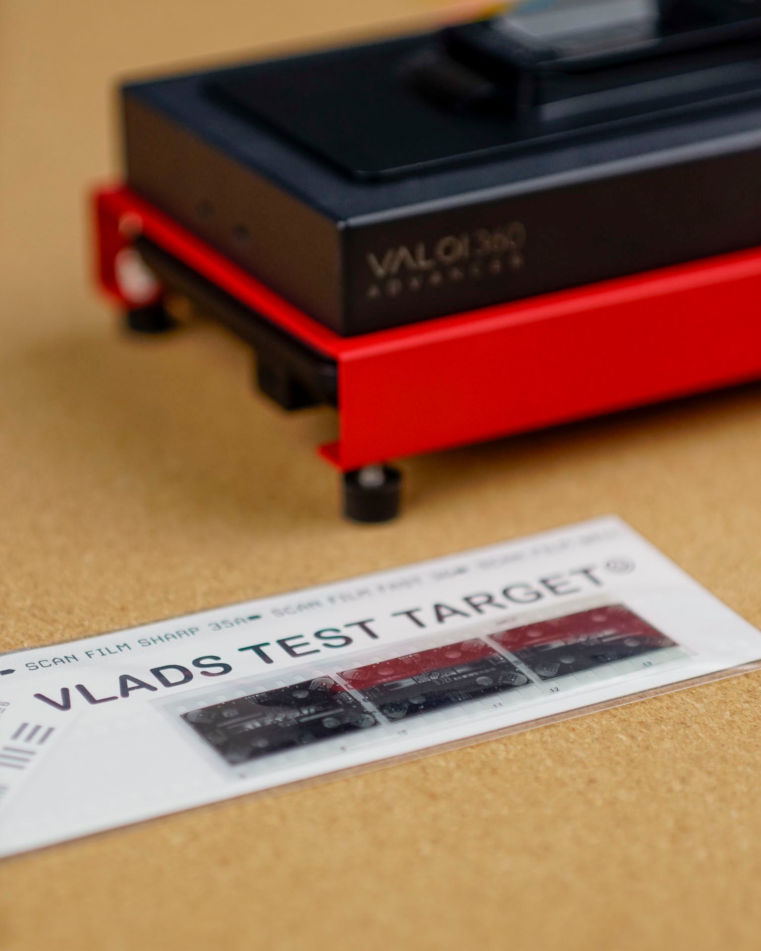 Vlad's Test Targets close-up with VALOI product on a brown background.
