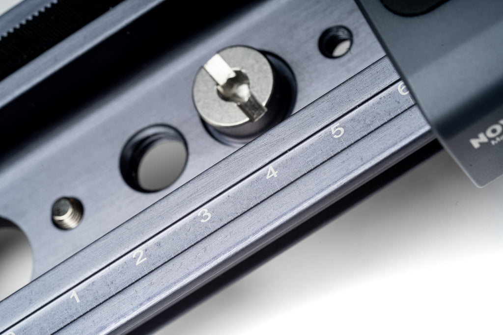 Novoflex CASTEL-MINI II macro rail close-up on a white background.