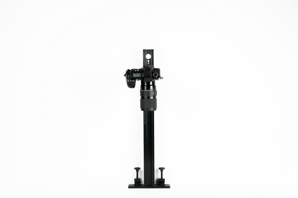 Novoflex Repro 650 stand with a camera body on a white background.