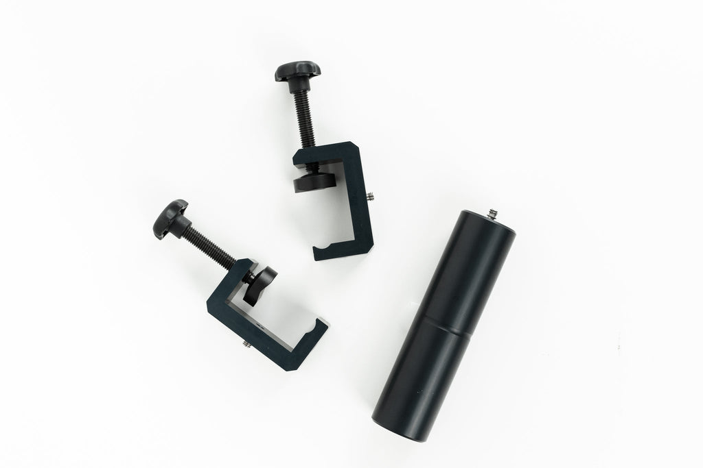 Novoflex Repro 650 clamps on a white background.