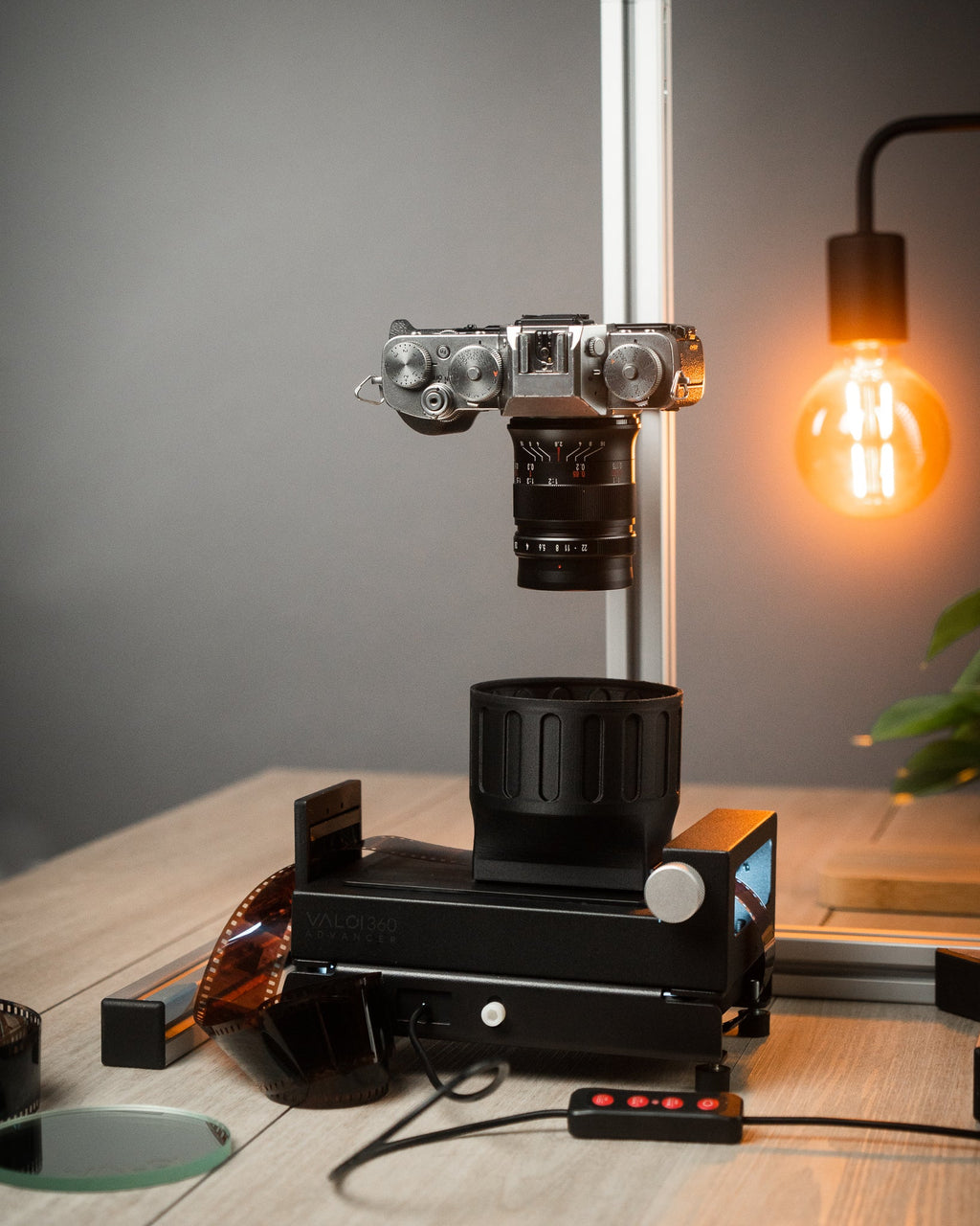 Valoi scanning kit with a camera on a wooden table. 